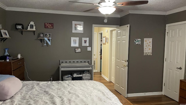 131 Sunny Gap, Conway, AR 72032 - bedroom featuring wood finished floors, crown molding, baseboards, a textured ceiling, and a ceiling fan