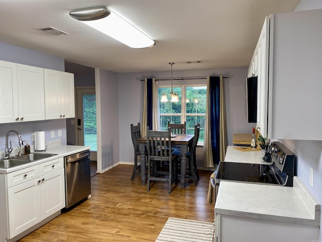 192 Shady Grove, Clarksville, AR 72830 - kitchen featuring a sink, stainless steel appliances, white cabinetry, and light countertops