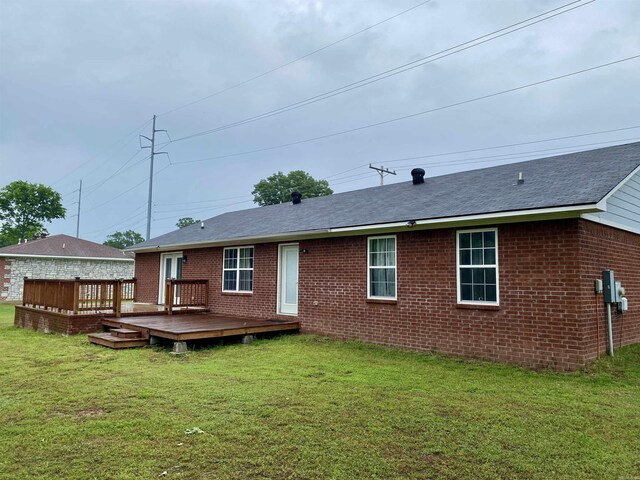 192 Shady Grove, Clarksville, AR 72830 - rear view of house with a wooden deck, brick siding, a lawn, and roof with shingles