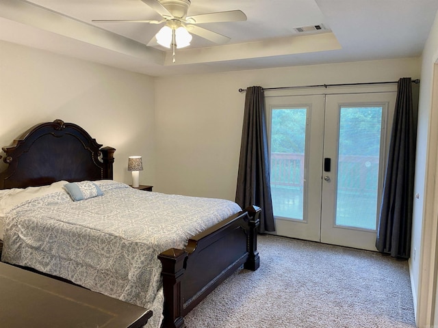 192 Shady Grove, Clarksville, AR 72830 - bedroom with french doors, access to outside, light carpet, a tray ceiling, and ceiling fan
