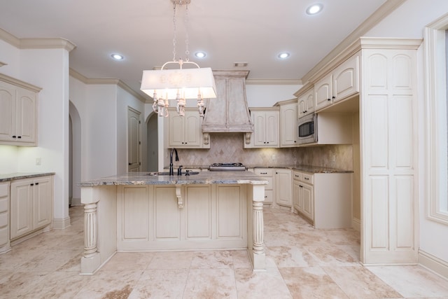 28 Talmont Pl, Little Rock, AR 72223 - kitchen with a sink, arched walkways, cream cabinetry, recessed lighting, and crown molding