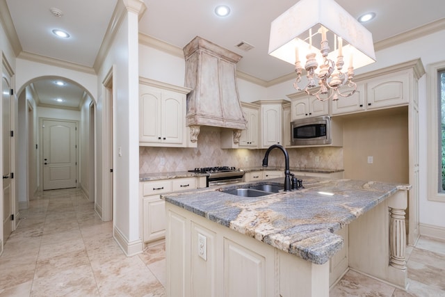 28 Talmont Pl, Little Rock, AR 72223 - kitchen with appliances with stainless steel finishes, a sink, ornamental molding, a chandelier, and decorative backsplash