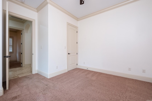 28 Talmont Pl, Little Rock, AR 72223 - spare room featuring ornamental molding, carpet, arched walkways, and baseboards