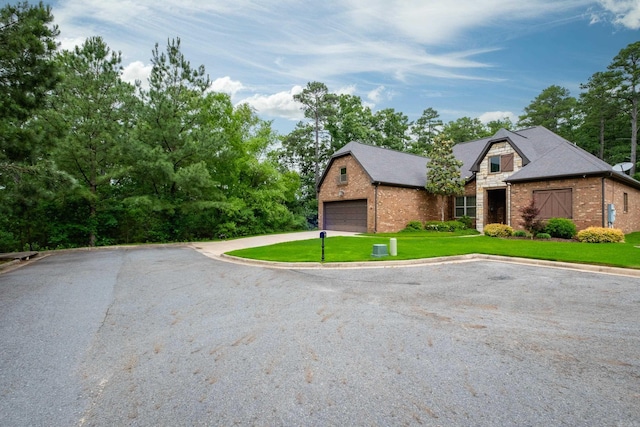 28 Talmont Pl, Little Rock, AR 72223 - view of front of house featuring brick siding, a front lawn, and driveway
