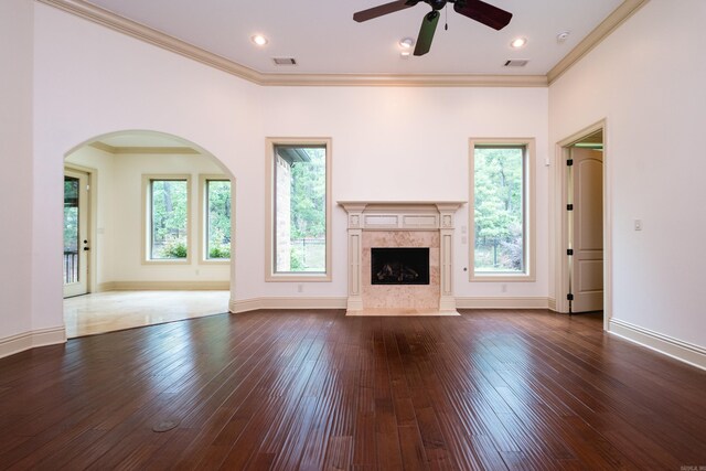 28 Talmont Pl, Little Rock, AR 72223 - unfurnished living room featuring dark wood-style flooring, healthy amount of natural light, a ceiling fan, a fireplace, and crown molding