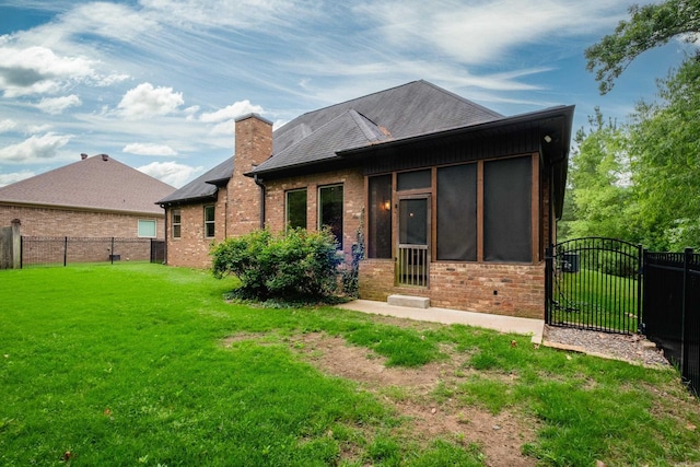 28 Talmont Pl, Little Rock, AR 72223 - back of house featuring a gate, a sunroom, brick siding, and a chimney