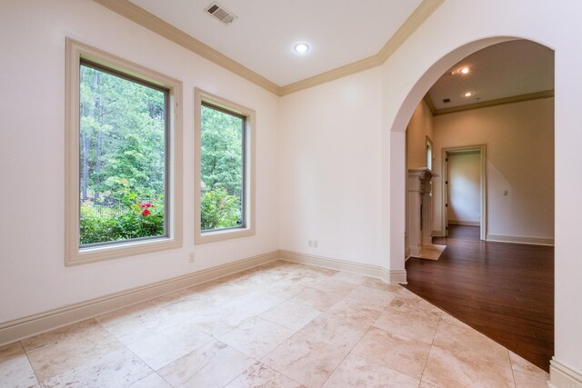 28 Talmont Pl, Little Rock, AR 72223 - spare room with arched walkways, ornamental molding, baseboards, and recessed lighting