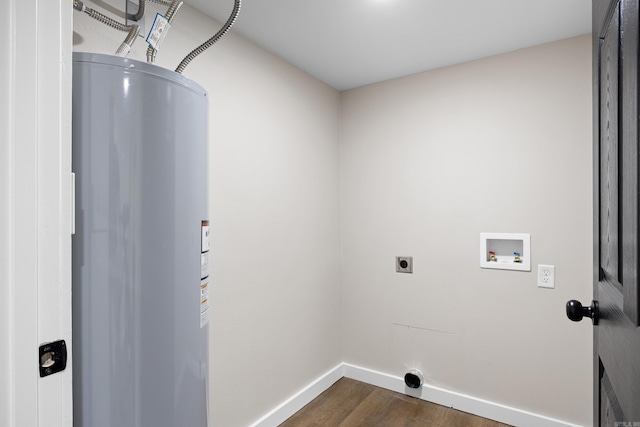 laundry area with water heater, electric dryer hookup, dark wood-style flooring, washer hookup, and baseboards