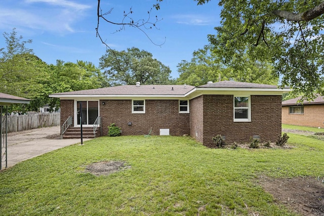 back of property featuring entry steps, brick siding, a patio, and crawl space
