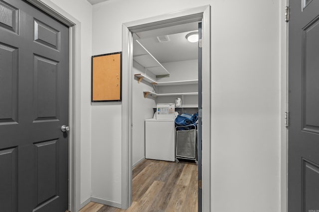 205 Michele St, Hot Springs, AR 71913 - washroom with light wood-style flooring, washing machine and clothes dryer, and baseboards