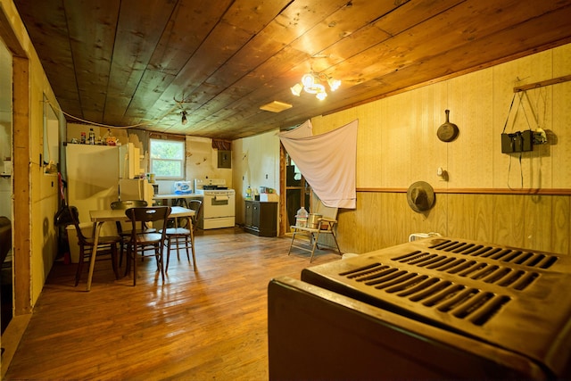 149 Firetower, Hardy, AR 72542 - kitchen with white range with gas stovetop, wooden ceiling, wood finished floors, and wood walls