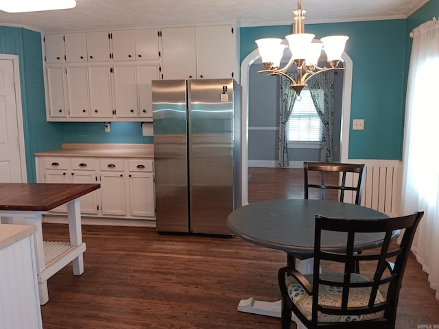 1000 Gum Springs Rd, Searcy, AR 72143 - kitchen featuring freestanding refrigerator, white cabinetry, dark wood-type flooring, a chandelier, and hanging light fixtures