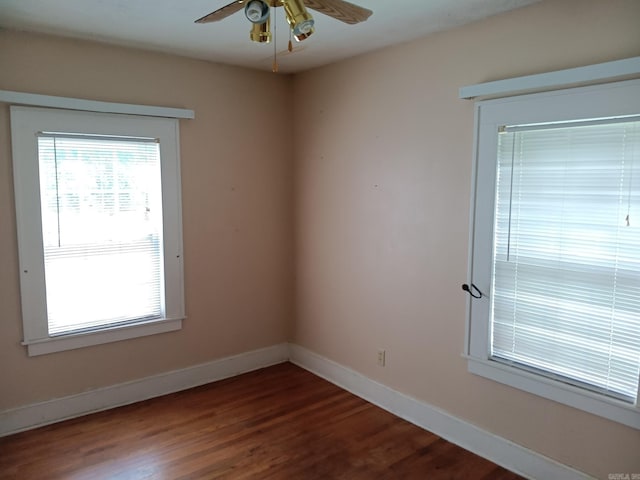 1000 Gum Springs Rd, Searcy, AR 72143 - unfurnished room featuring a ceiling fan, dark wood-style flooring, and baseboards