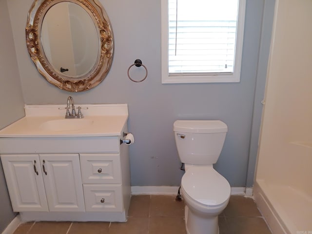 1000 Gum Springs Rd, Searcy, AR 72143 - bathroom with tile patterned flooring, toilet, vanity, and baseboards
