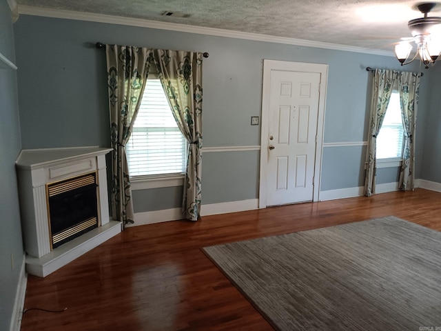 1000 Gum Springs Rd, Searcy, AR 72143 - unfurnished living room featuring wood finished floors, a glass covered fireplace, baseboards, ceiling fan, and crown molding