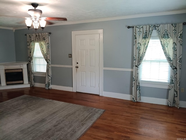 1000 Gum Springs Rd, Searcy, AR 72143 - foyer featuring ceiling fan, a fireplace with raised hearth, wood finished floors, baseboards, and ornamental molding