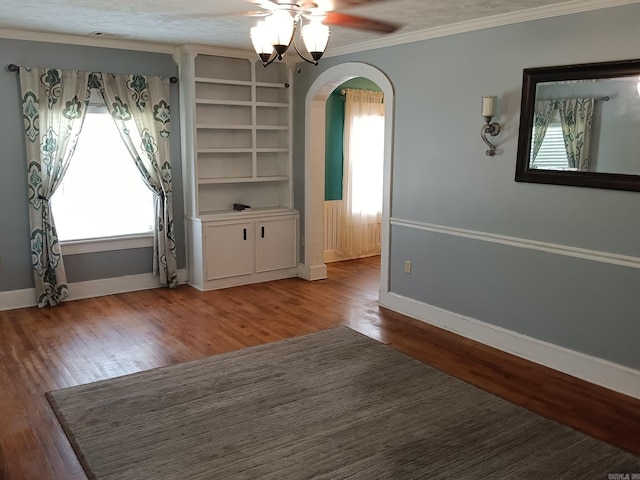 1000 Gum Springs Rd, Searcy, AR 72143 - unfurnished dining area featuring plenty of natural light, a ceiling fan, arched walkways, ornamental molding, and light wood-type flooring