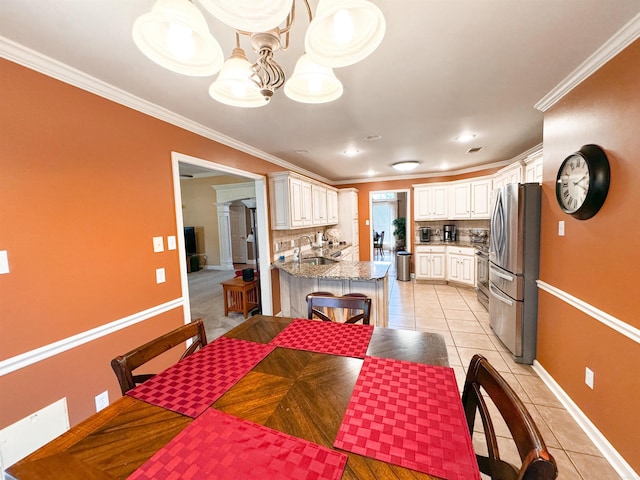 6 Palmer Ct, Searcy, AR 72143 - dining room with light tile patterned floors, baseboards, crown molding, recessed lighting, and a chandelier