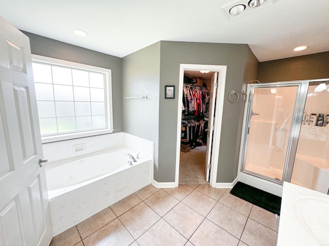 6 Palmer Ct, Searcy, AR 72143 - full bath featuring a shower stall, a walk in closet, tile patterned floors, a tub with jets, and baseboards