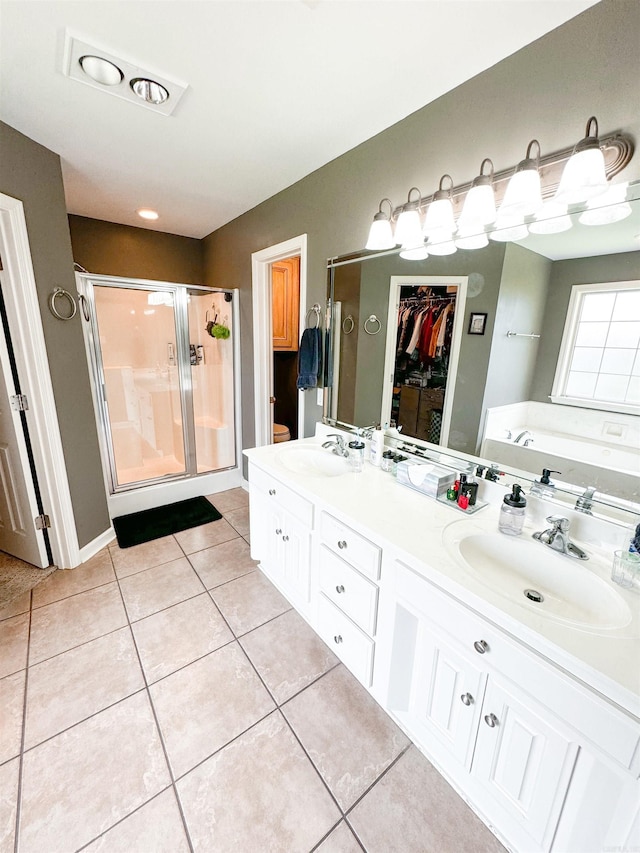 6 Palmer Ct, Searcy, AR 72143 - full bath featuring a stall shower, a garden tub, tile patterned floors, a walk in closet, and double vanity
