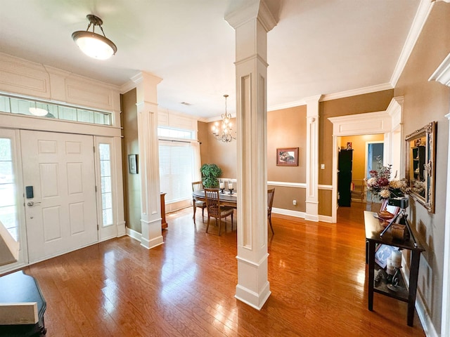 6 Palmer Ct, Searcy, AR 72143 - entrance foyer with ornate columns, ornamental molding, and wood finished floors
