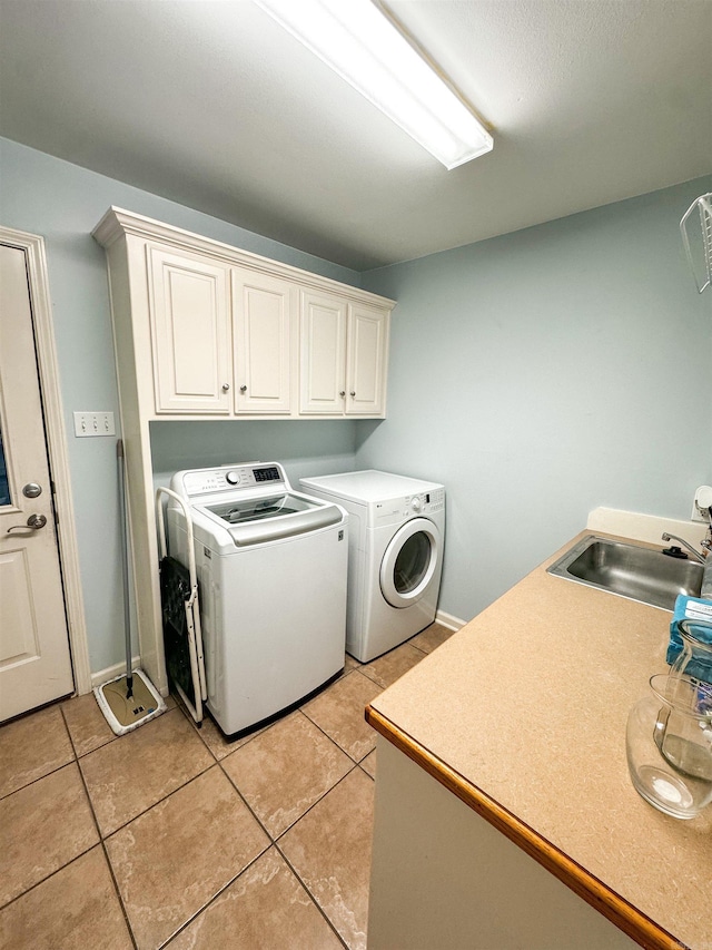 6 Palmer Ct, Searcy, AR 72143 - laundry room with cabinet space, washer and dryer, light tile patterned flooring, and baseboards