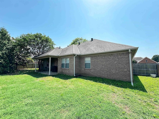 6 Palmer Ct, Searcy, AR 72143 - rear view of house with brick siding, a shingled roof, and a patio area