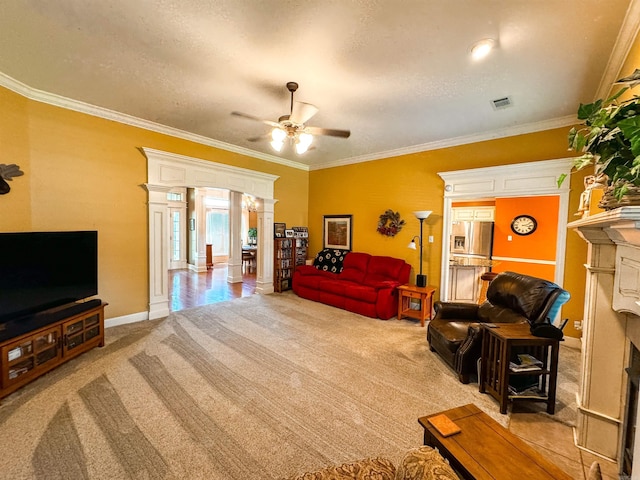 6 Palmer Ct, Searcy, AR 72143 - living room with a fireplace, light carpet, ornate columns, a ceiling fan, and ornamental molding