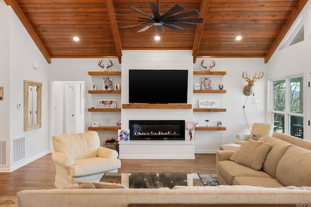 9 Lakeview Ter, Mount Ida, AR 71957 - living area with wood ceiling, a ceiling fan, baseboards, wood finished floors, and a large fireplace