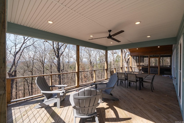 9 Lakeview Ter, Mount Ida, AR 71957 - wooden deck with outdoor dining area and a ceiling fan