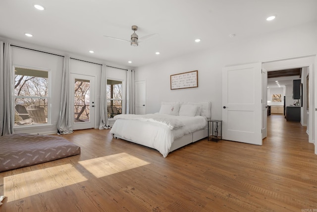 9 Lakeview Ter, Mount Ida, AR 71957 - bedroom featuring light wood-style floors, access to exterior, multiple windows, recessed lighting, and a ceiling fan