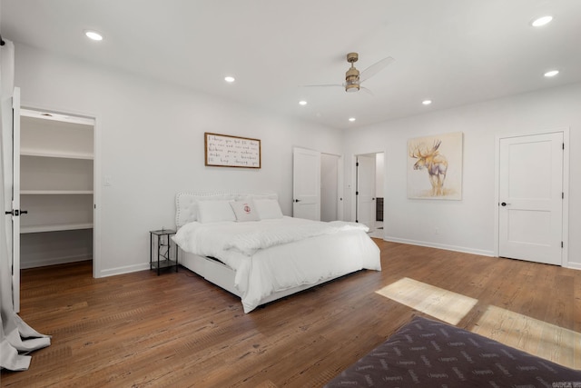 9 Lakeview Ter, Mount Ida, AR 71957 - bedroom featuring baseboards, wood finished floors, recessed lighting, a ceiling fan, and a spacious closet