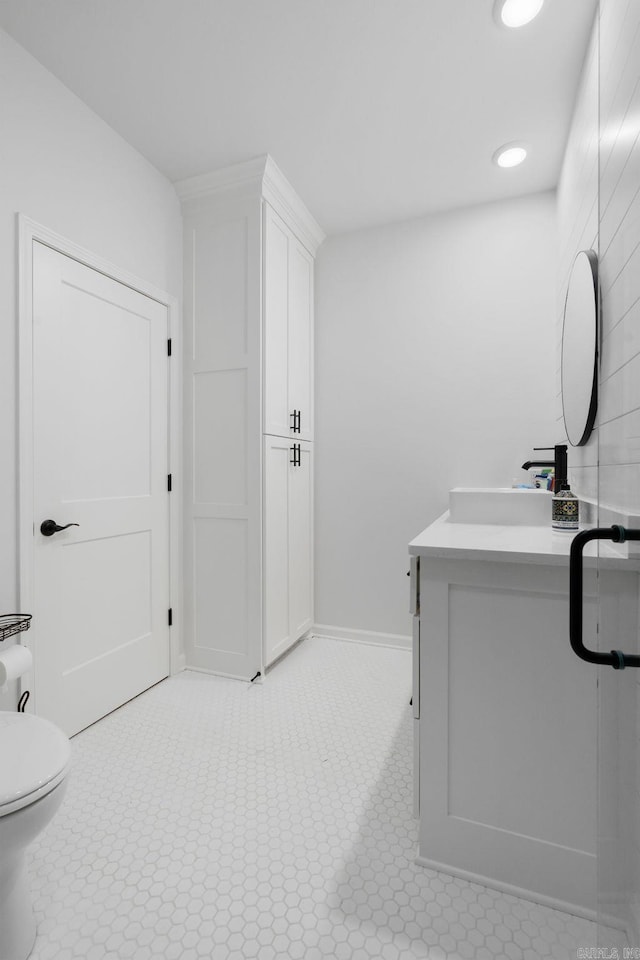 9 Lakeview Ter, Mount Ida, AR 71957 - bathroom with vanity, toilet, recessed lighting, tile patterned floors, and baseboards