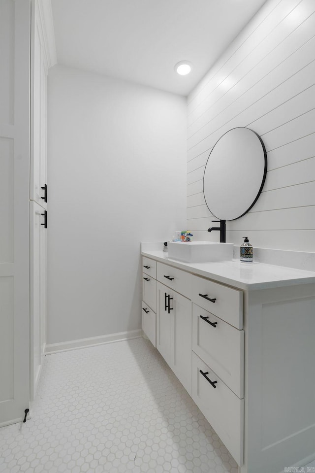 9 Lakeview Ter, Mount Ida, AR 71957 - bathroom with vanity, baseboards, and wood walls