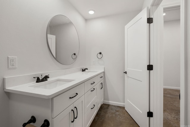 9 Lakeview Ter, Mount Ida, AR 71957 - bathroom featuring double vanity, concrete flooring, and baseboards