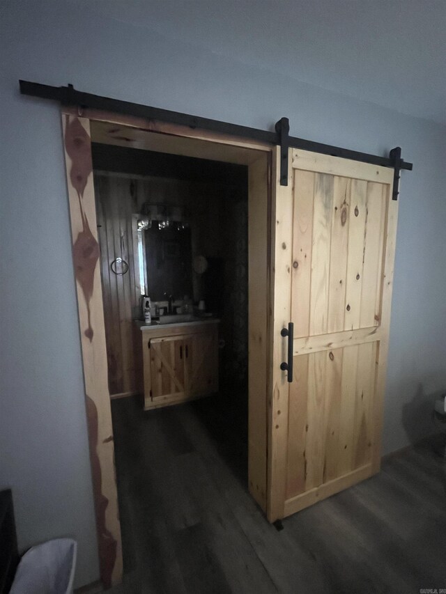 1026 Wilson St, Malvern, AR 72104 - corridor with wood finished floors and a barn door