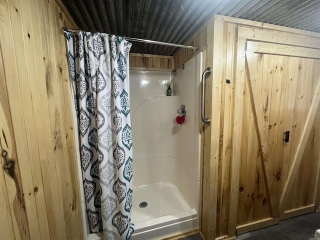 1026 Wilson St, Malvern, AR 72104 - bathroom with wooden walls and a shower stall