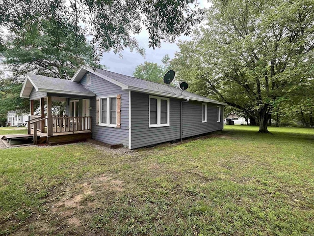 1026 Wilson St, Malvern, AR 72104 - view of home's exterior featuring a yard and roof with shingles