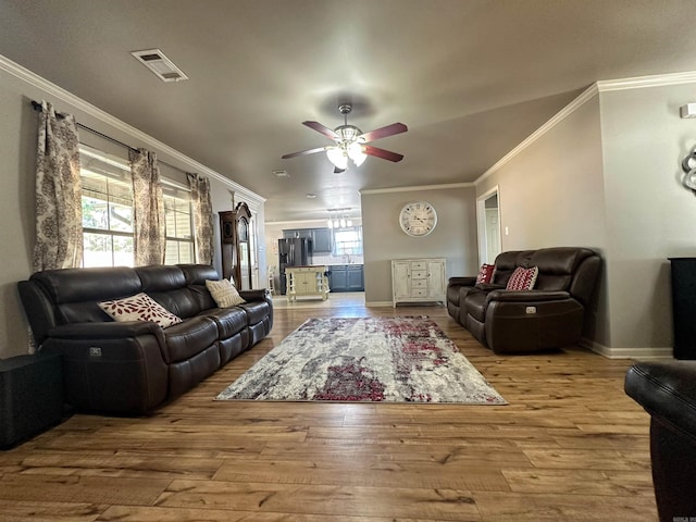 12548 Birch Glen Cv, Alexander, AR 72002 - living room with a ceiling fan, ornamental molding, wood finished floors, and baseboards