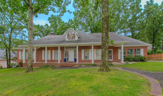10 Silverwood Ct, North Little Rock, AR 72116 - view of front of property with brick siding, a chimney, and roof with shingles