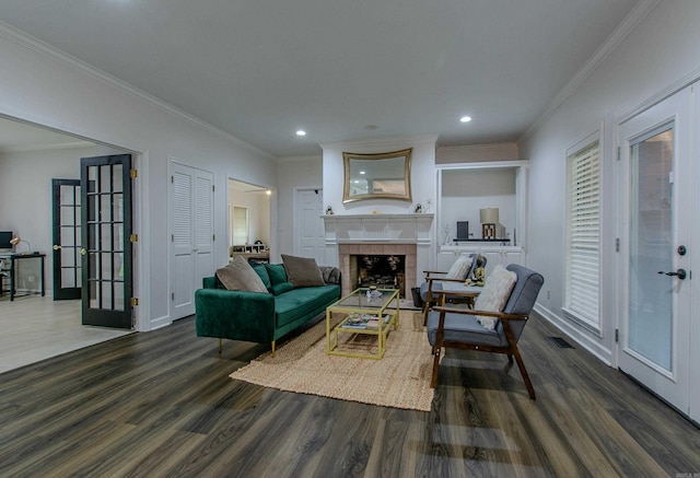 10 Silverwood Ct, North Little Rock, AR 72116 - living area with dark wood finished floors, a tiled fireplace, ornamental molding, french doors, and recessed lighting