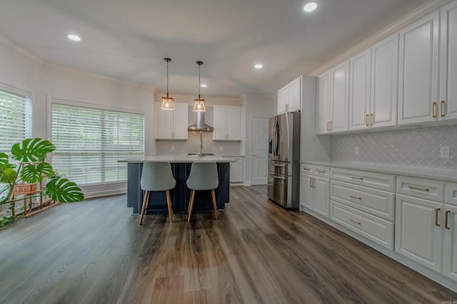 10 Silverwood Ct, North Little Rock, AR 72116 - kitchen featuring stainless steel fridge with ice dispenser, wall chimney exhaust hood, white cabinets, light countertops, and healthy amount of natural light