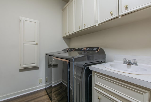 10 Silverwood Ct, North Little Rock, AR 72116 - washroom featuring cabinet space, separate washer and dryer, dark wood finished floors, and baseboards