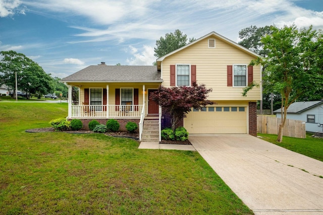 1520 Calgary Cv, Little Rock, AR 72211 - tri-level home featuring a porch, a garage, driveway, and brick siding