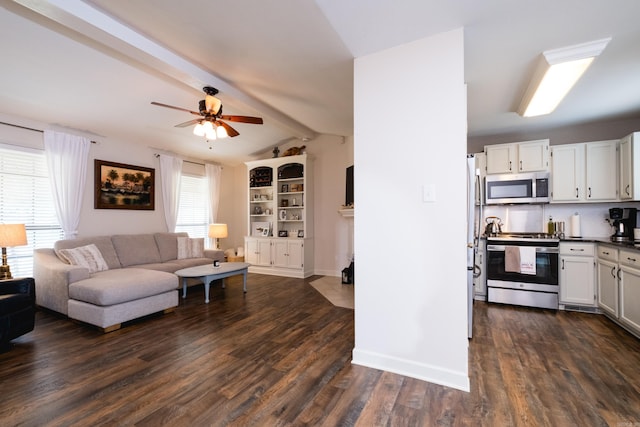 1520 Calgary Cv, Little Rock, AR 72211 - living area with healthy amount of natural light, dark wood-style flooring, a ceiling fan, and baseboards