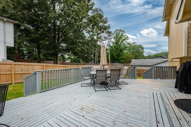 1520 Calgary Cv, Little Rock, AR 72211 - wooden terrace featuring a fenced backyard and outdoor dining space