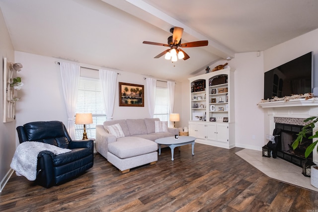1520 Calgary Cv, Little Rock, AR 72211 - living room with dark wood-type flooring, a tile fireplace, ceiling fan, and baseboards