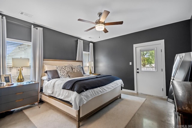 305 W Cross St, Benton, AR 72015 - bedroom featuring finished concrete floors, a ceiling fan, and baseboards