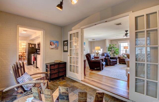 3901 Cedar Hill Rd, Little Rock, AR 72202 - sitting room with french doors, ceiling fan, and wood finished floors