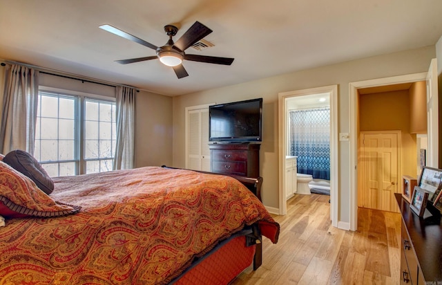 3901 Cedar Hill Rd, Little Rock, AR 72202 - bedroom featuring light wood-style flooring, a ceiling fan, ensuite bath, baseboards, and a closet